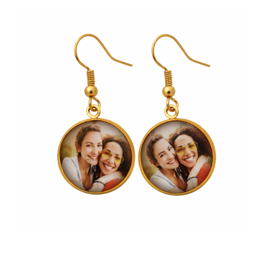 Gold earrings with circular charms featuring a photo of two women on a white background