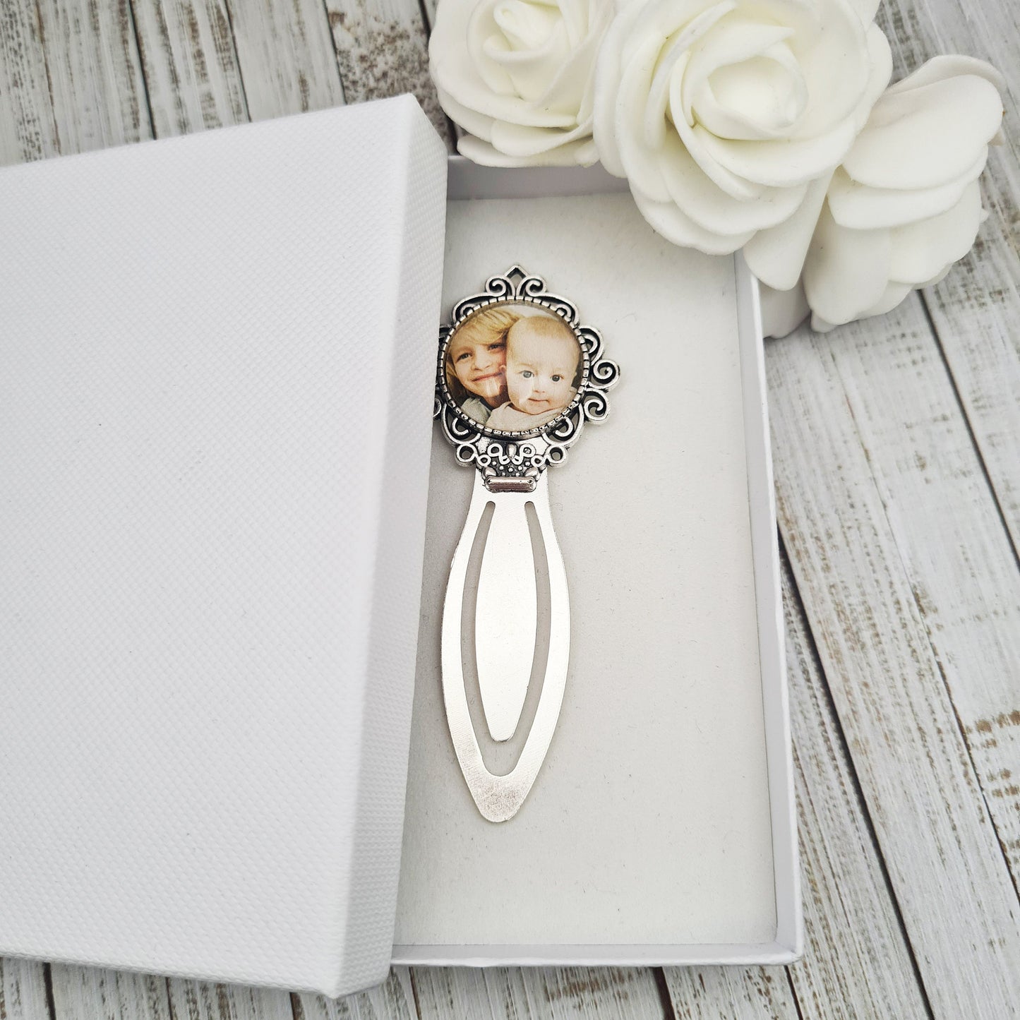 Silver bookmark personalised with a photo set in glass inside a white box