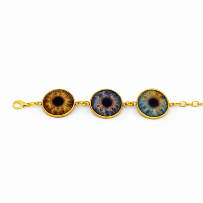 Bracelet with three eye-shaped charms on a white background