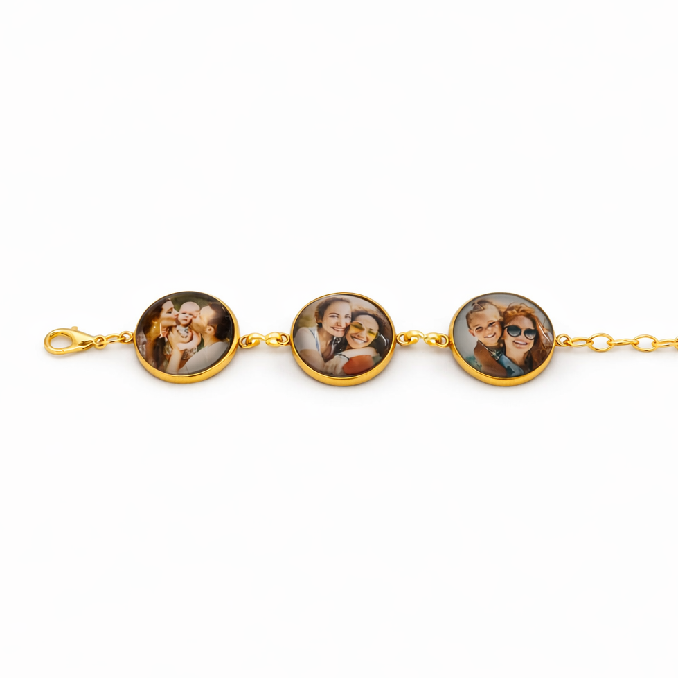 Gold bracelet with three round charms featuring photos on a white background