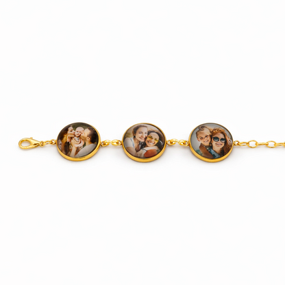 Gold bracelet with three round charms featuring photos on a white background