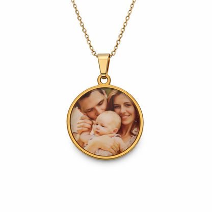 Gold necklace with a round pendant featuring a photo of a woman holding a baby on a white background