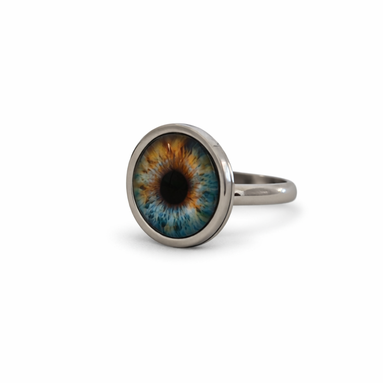 Ring with a colorful eye design on a white background