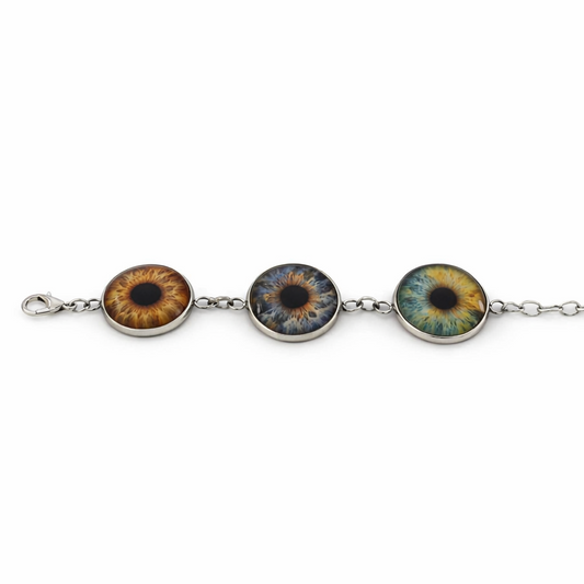 Bracelet with three circular eye-shaped charms on a white background