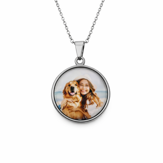 Round pendant necklace with a photo of a woman and dog on a white background